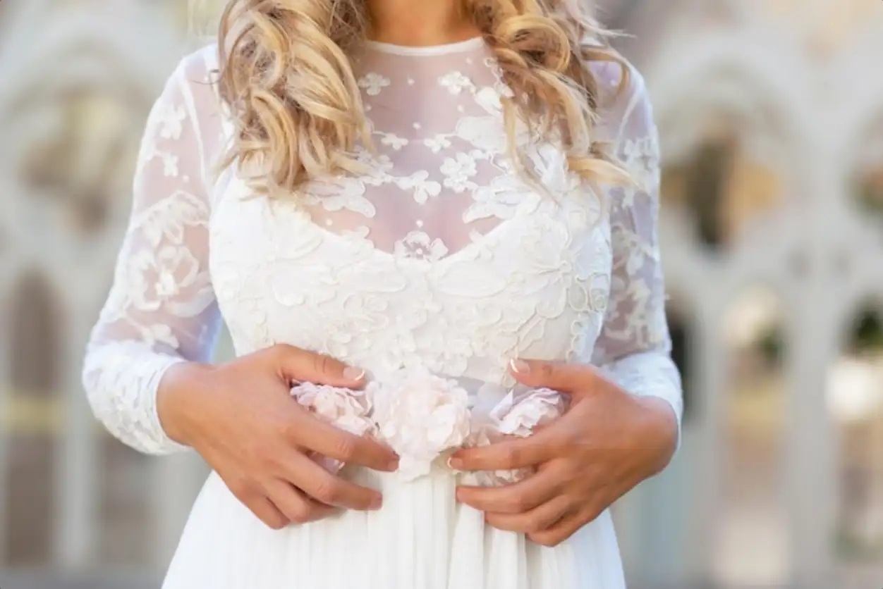 Midsection of bride standing outdoors