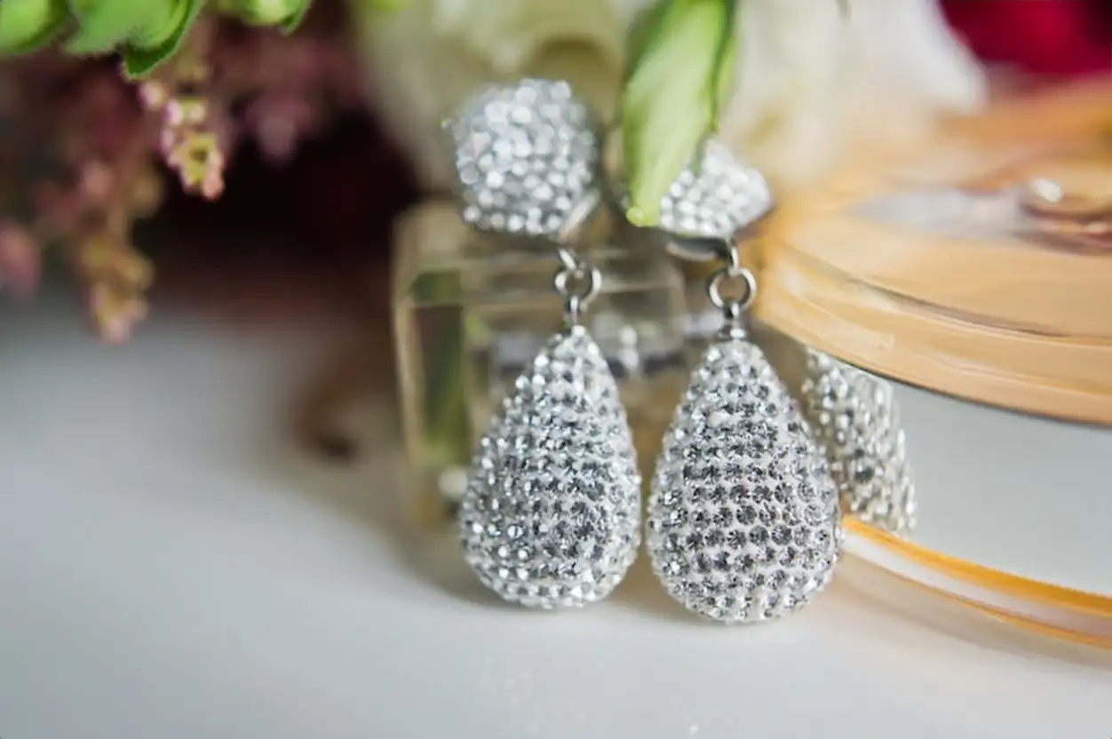 Close up of diamond earrings. close up, space for your text