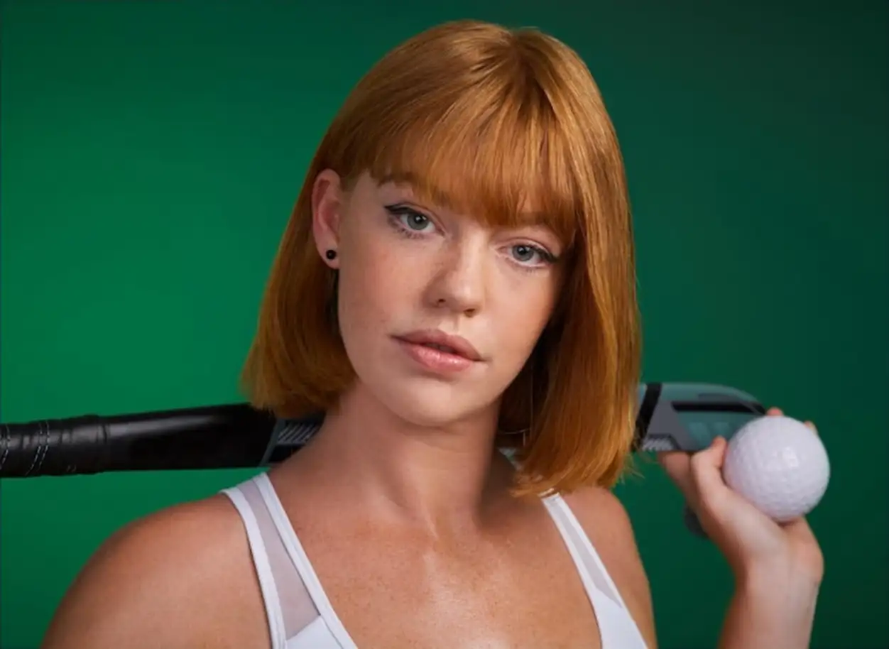 Hockey portrait and woman in studio for sport workout challenge and training for game tournament Female athlete redhead and equipment in green background for practice competition and fitness
