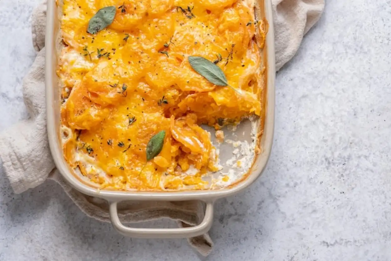 Sweet potato gratin with cream in baking dish