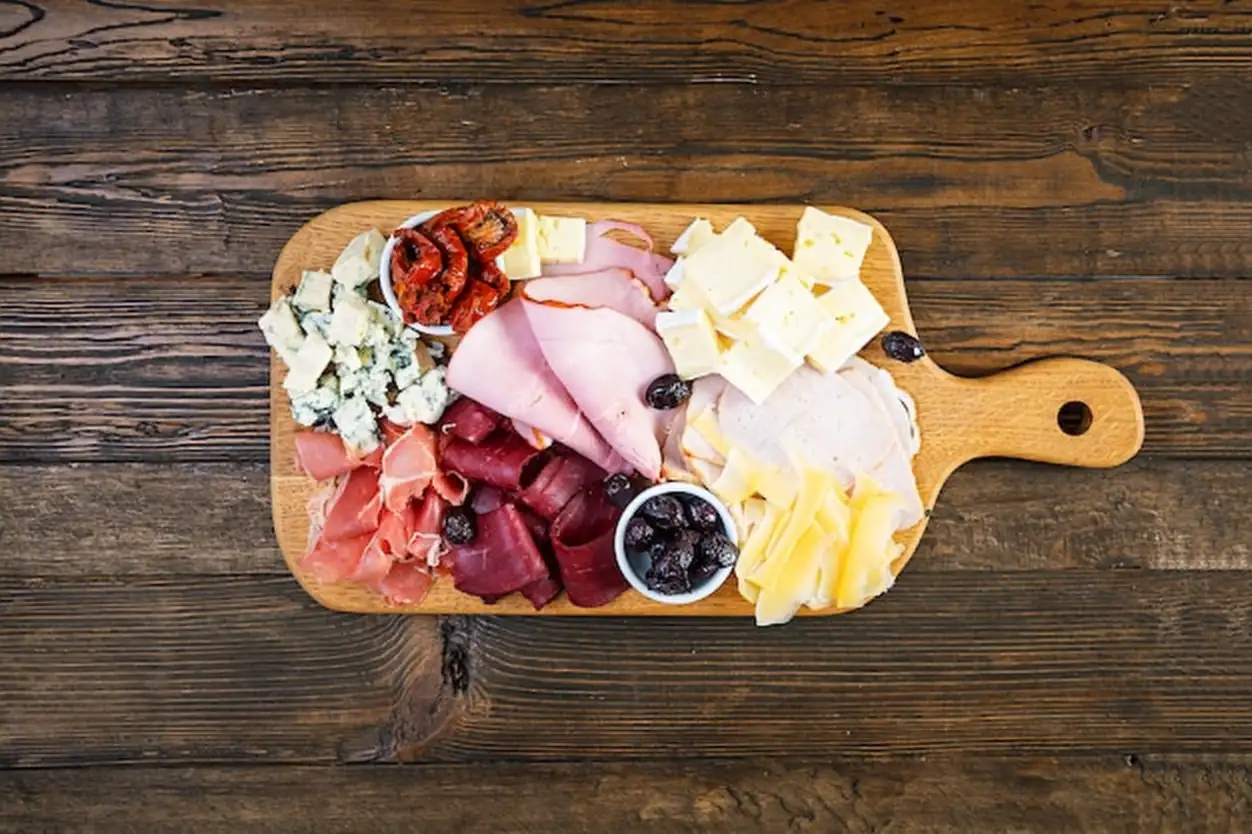 Antipasti board with ham, cheese and olives