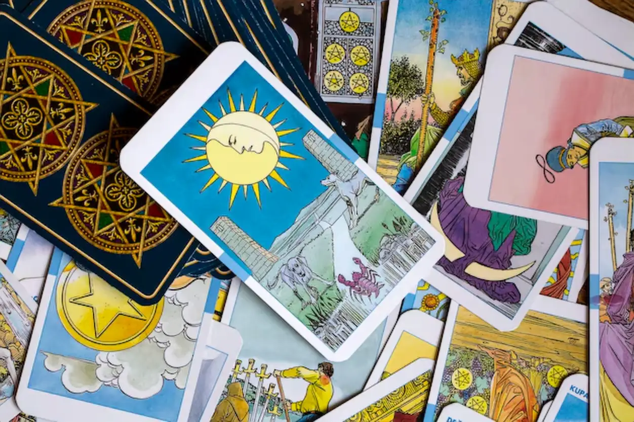 Assorted tarot cards scattered on a table, seamless pattern