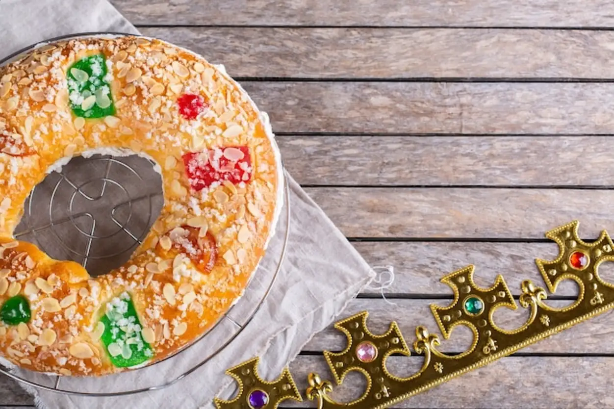 Traditional spanish epiphany cake roscon de reyes with festive decorations