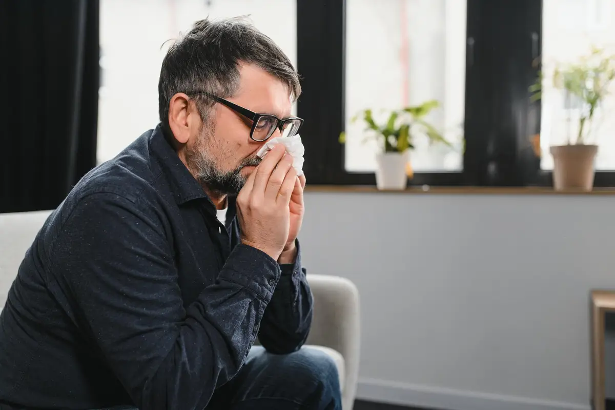person coughing headache